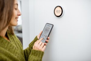 woman-checking-thermostat-readings